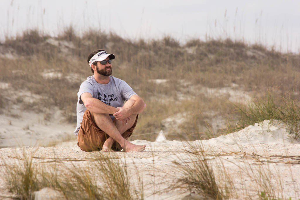 Sean pouting on the beach.