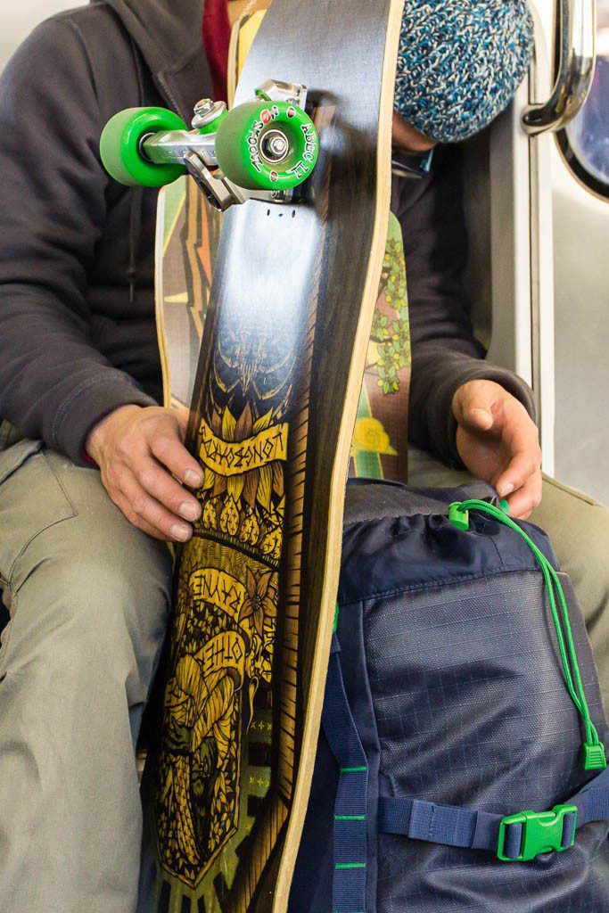 Skater kid in a beanie on the train