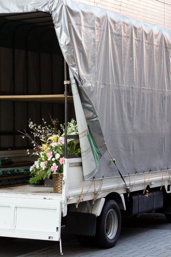 Bouquet of flowers in the back of a box van.