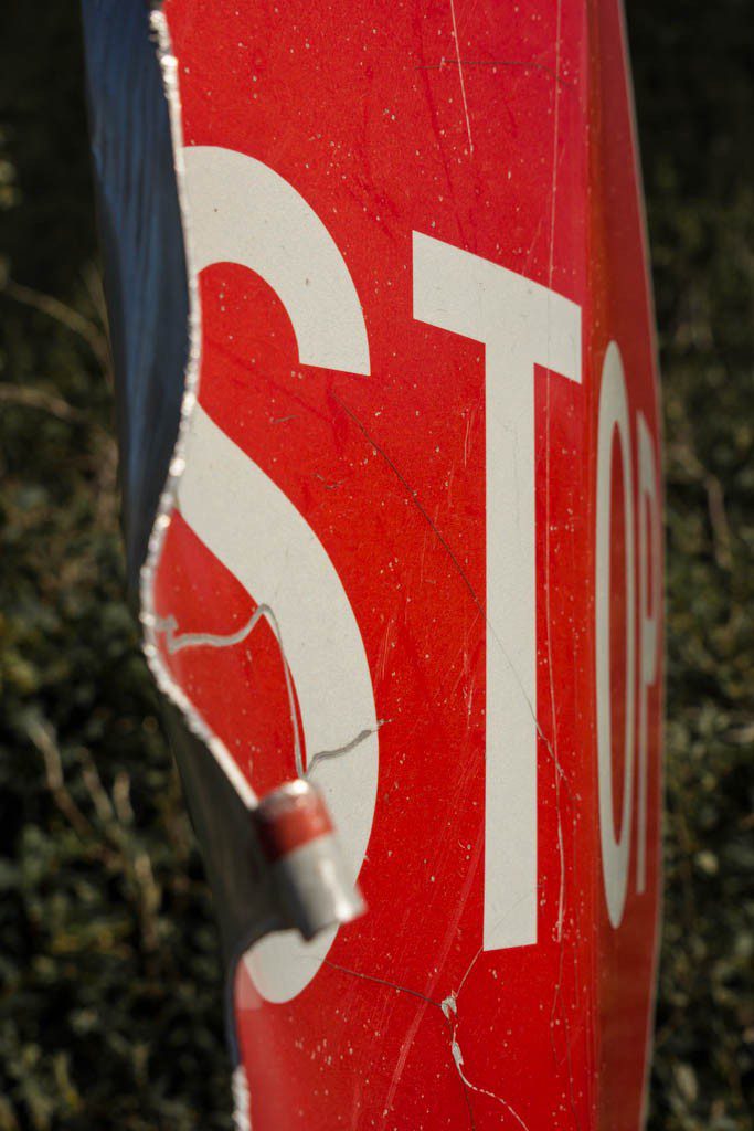 Stop sign looking pretty rough