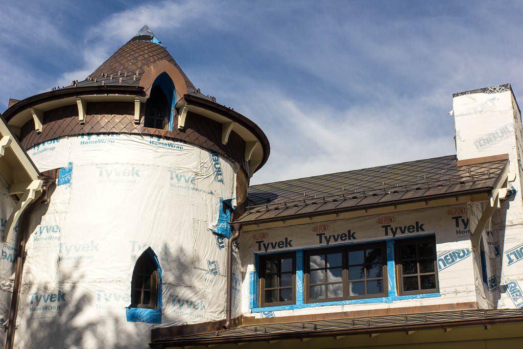 I thought the contrast between the expensive building and fancy roofline with the blue tape and tyvek was humorous.