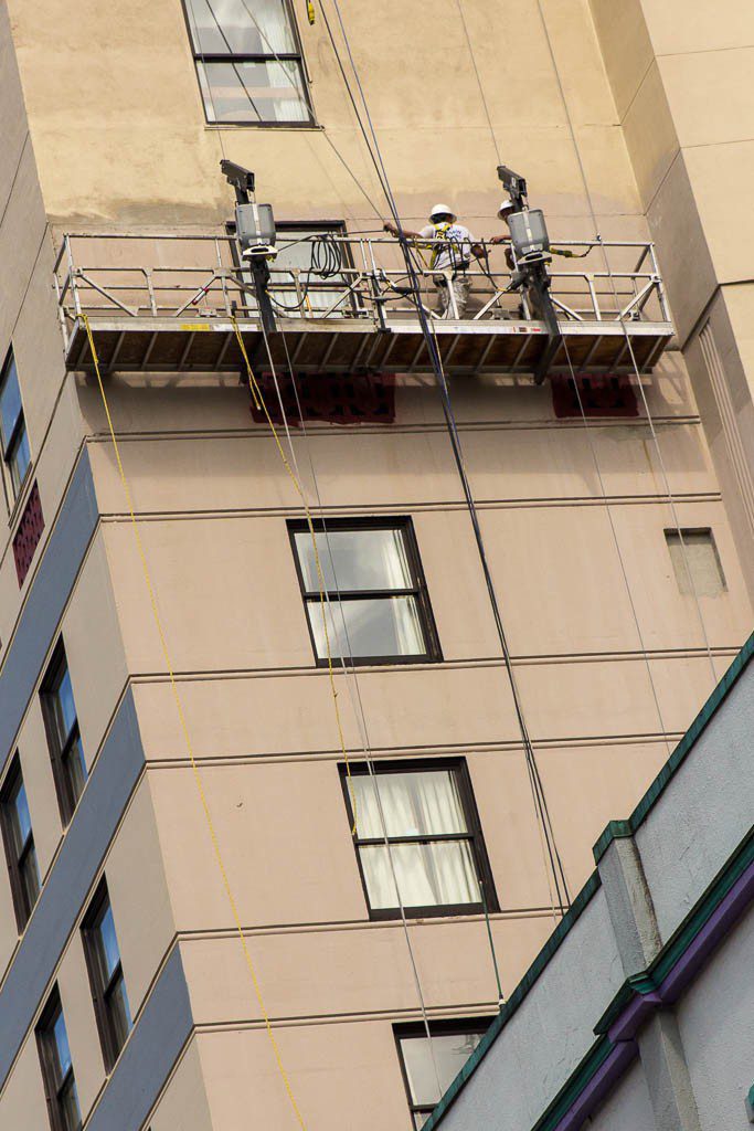 guys fixing up one of the buildings. There are quite a few that need some more upkeep out here. 