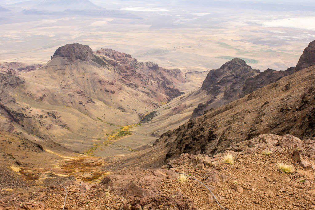 The mountain seems even taller from the flat desert below.