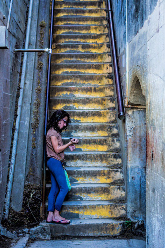 Girl at the bottom of the stairs