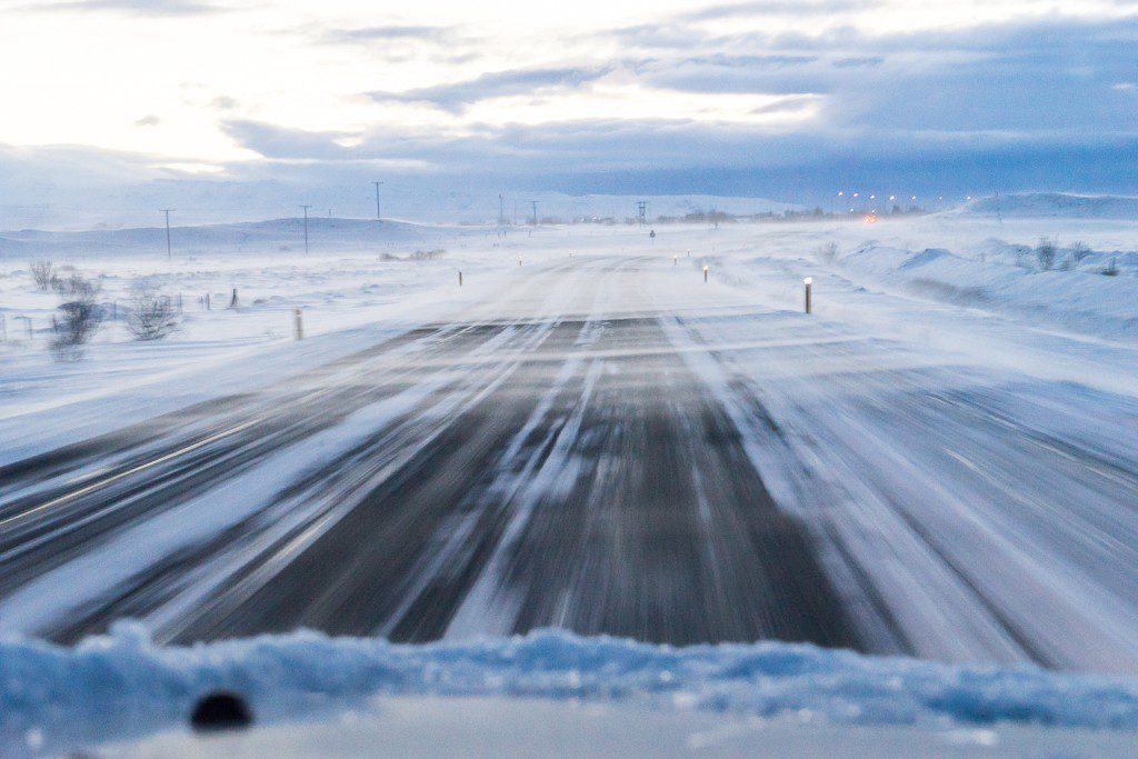 More snow blowing across the road. Our CAR almost got blown off the road once. Iceland is intense!