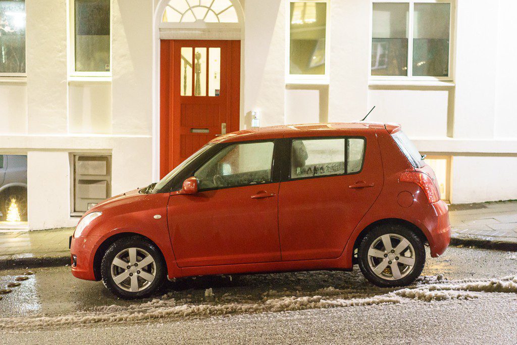 This is what most people drive. I wouldn't have taken it's picture except I liked the red car against the red door. 