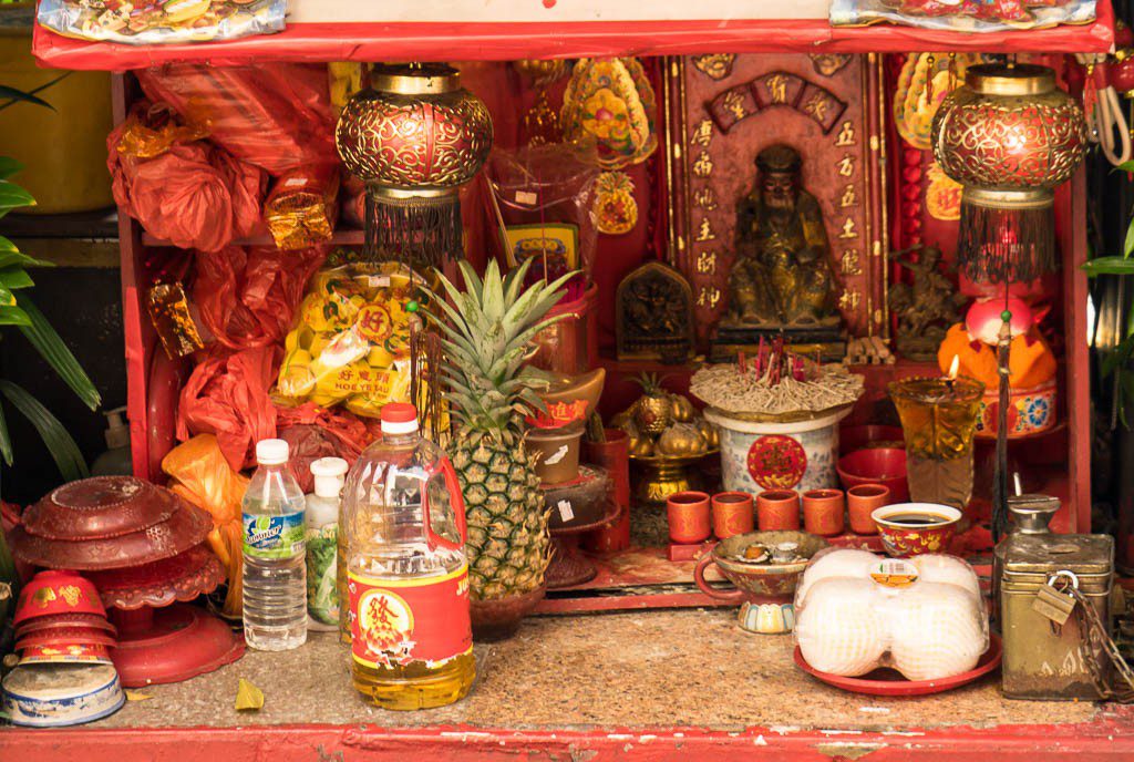 Small shrine along the street outside the hotel lobby.