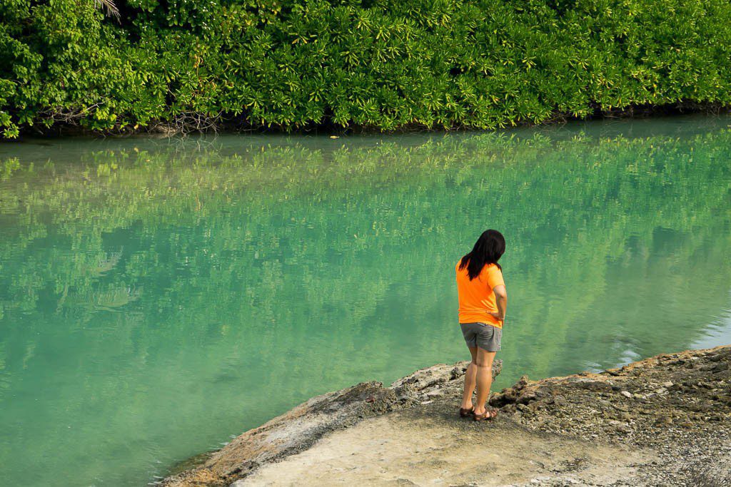 Orange shirt against blue water