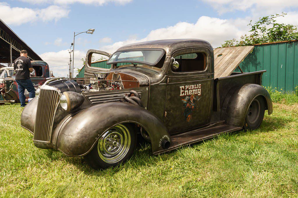 It's a 36/37 Chevy just like my truck.  The fenderwell headers with the access hole cut in the fender are sick. The stance is also perfect. Low but usable. 