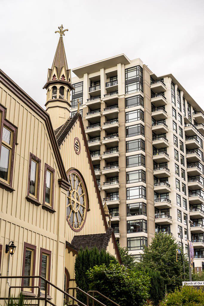 Contrast between a church and a high rise