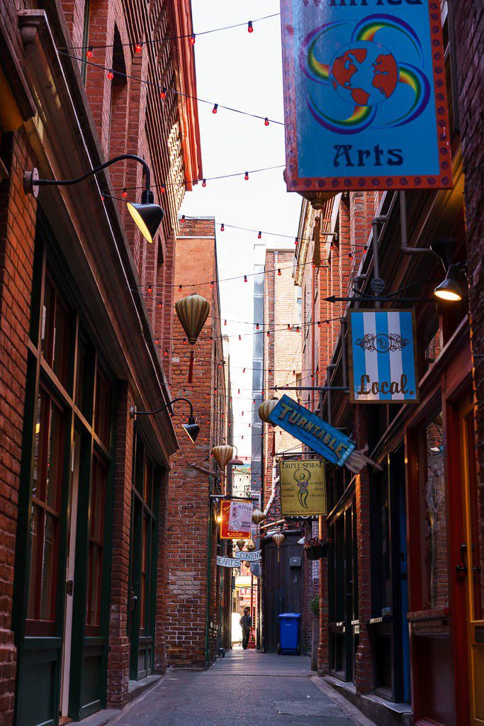 A slightly larger alley full of cool shops