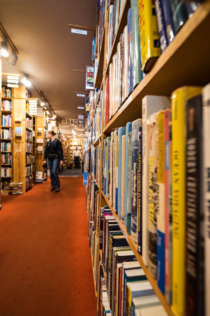 Rashell in the book store. I needed to get lower while taking this so she would be higher in the photo and there would be less ceiling showing.