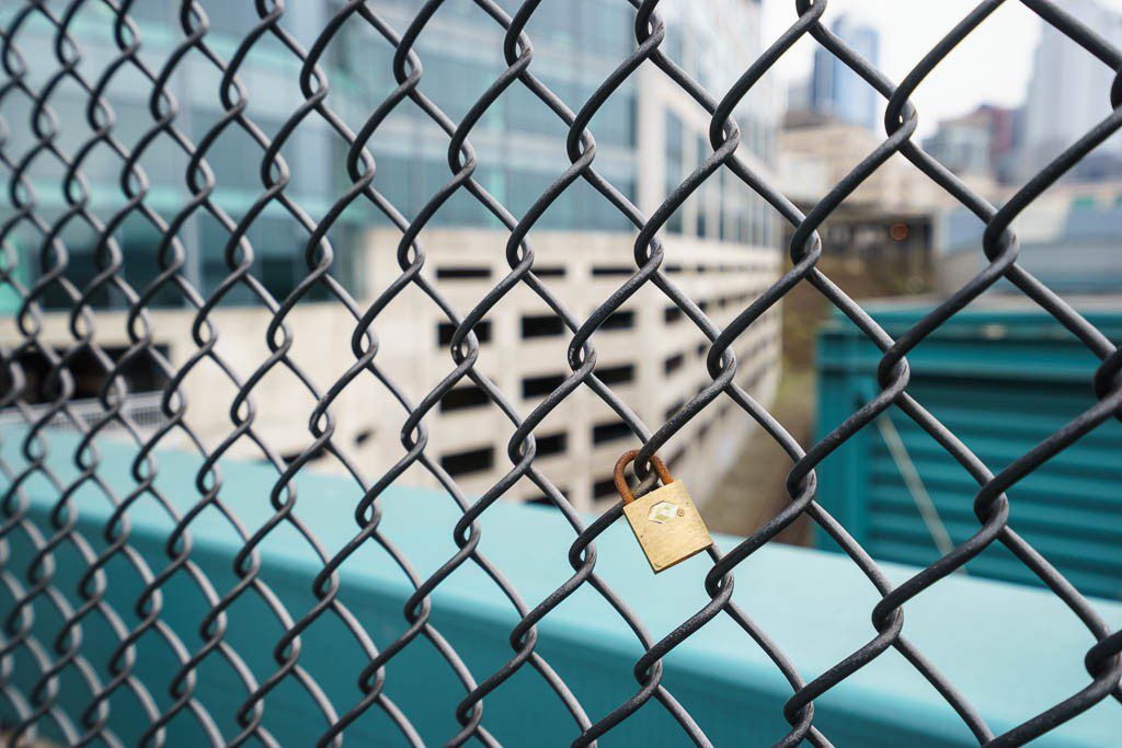 Tiny lock on the chainlink fence