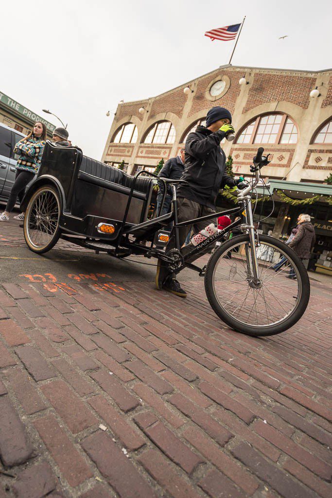 Bicycle taxi. I bet that guy has some leg muscles!!!